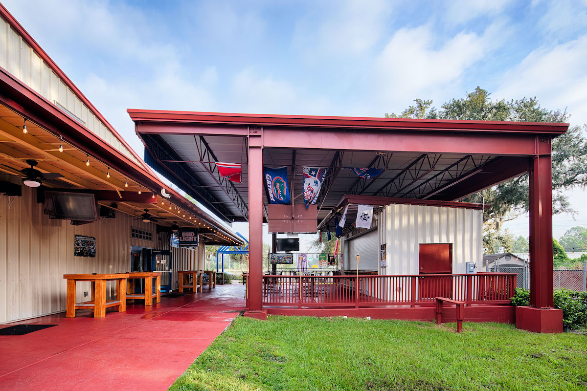 outdoor restaurant and bar with exposed steel post and beam and steel frame